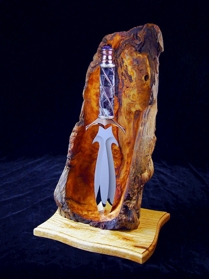 "Amethystine" dagger in 440C high chromium stainless steel blade, diffusion welded copper, nickel silver fittings, Lace Amethyst, sterling silver handle with Amethyst crystal, Ponderosa Pine burl and Red Oak stand