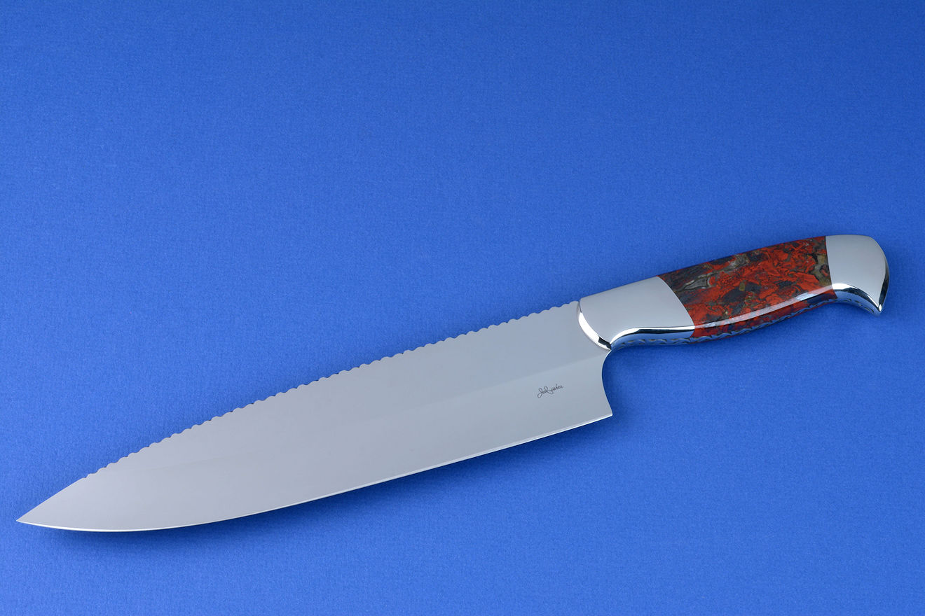 "Concordia" fine master chef's knife, obverse side view in CPM154CM high molybdenum powder metal technology tool steel blade, 304 stainless steel bolsters, Brecciated African Jasper gemstone handle, chef's roll case in latigo side leather and leather shoulder, hand-tooled, hand stitched with stainless steel snaps