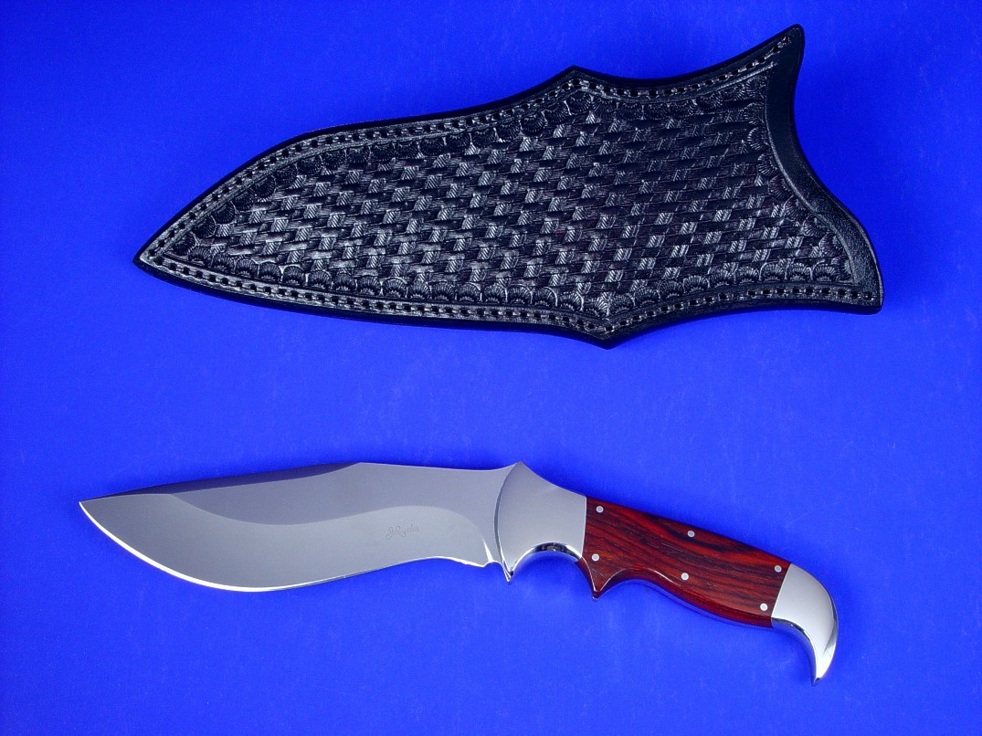 "Hooded Warrior" obverse side view in 440C high chromium stainless steel blade, 304 stainless steel bolsters, cocobolo exotic hardwood handle, black cherry basketweave hand-tooled leather sheath