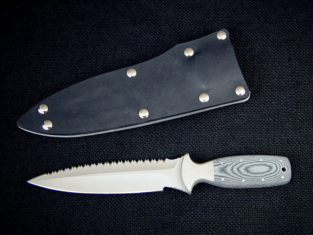 "Vampire" Rip Tooth Serrations; "Lynx" combat, tactcal, CSAR knife, obverse side view: 440C high chromium stainless steel blade, 304 stainless steel bolsters, Micarta phenolic handle, kydex, aluminum, nickel plated steel sheath