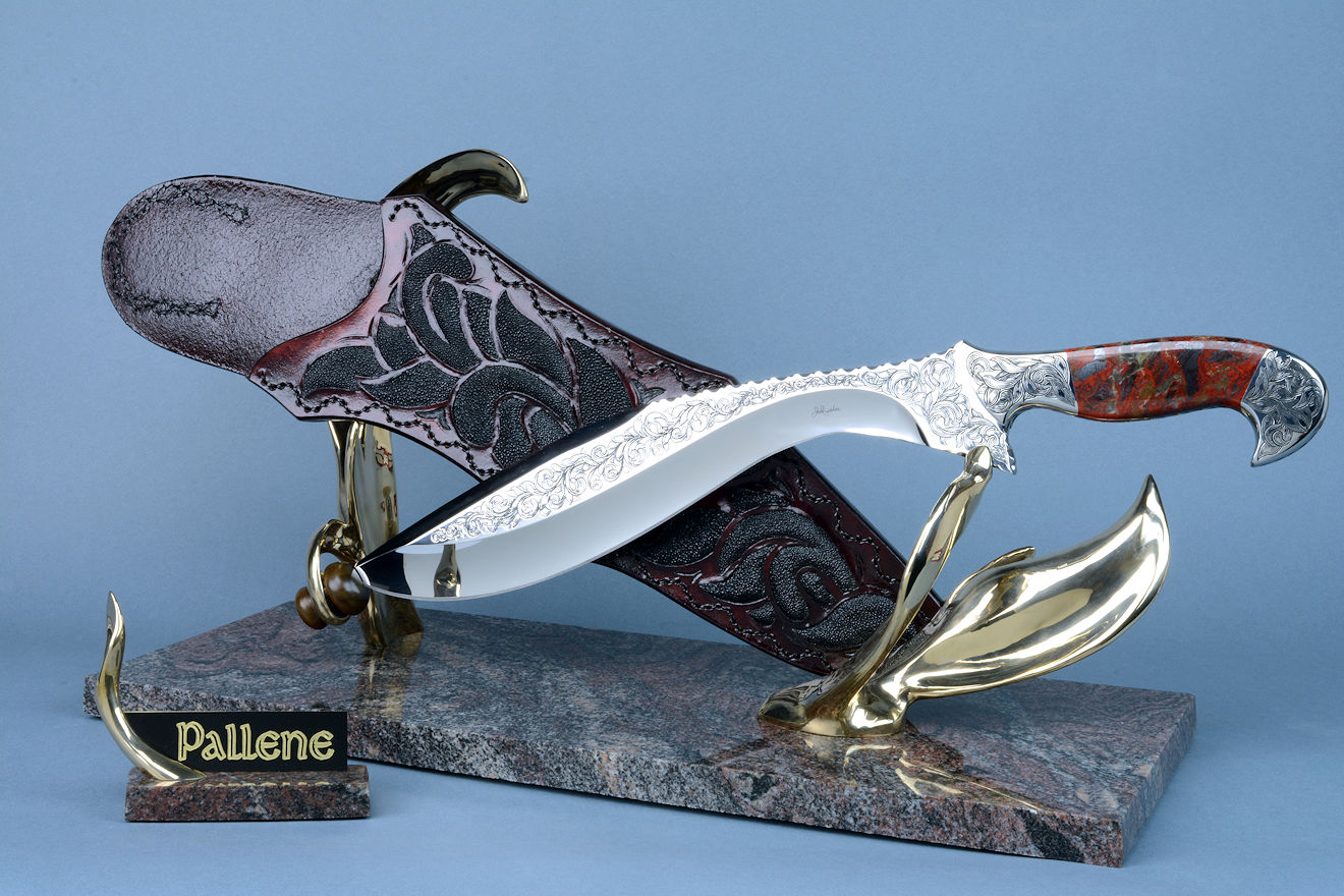 "Pallene" khukri, obverse side view in CPM154CM High molybdenum powder metal technology stainless tool steel blade, hand engraved, with hand-engraved 304 stainless steel bolsters, Brecciated Jasper gemstone  handle, hand-carved leather sheath inlaid with rayskin, hand-cast silicon bronze and Imbuya hardwood stand and Paradiso Classico Granite base