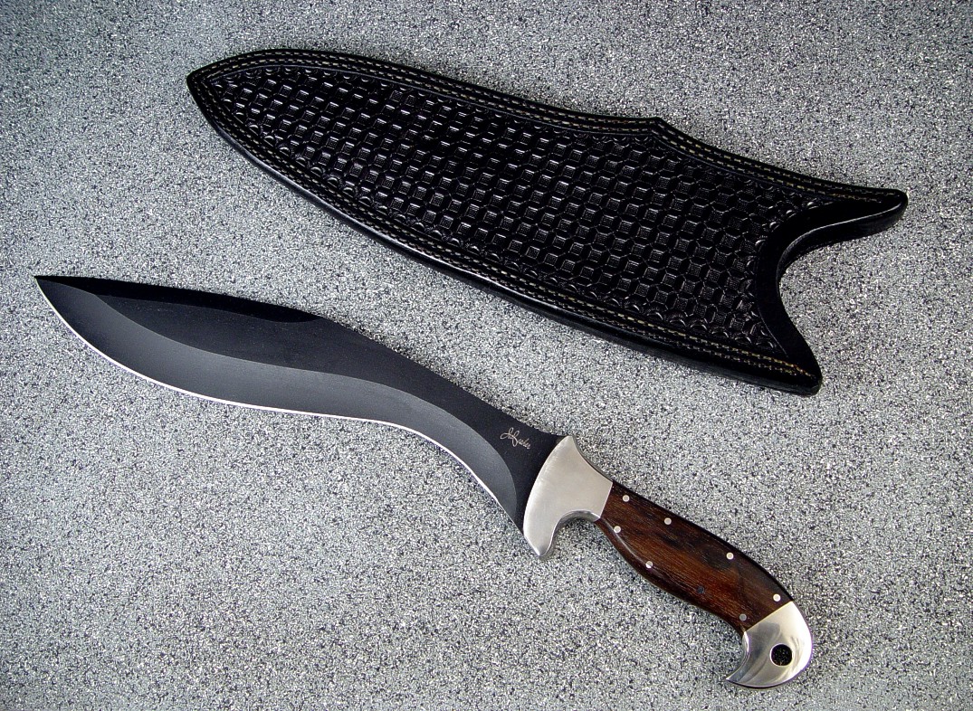 "Phlegra" Khukri, Obverse side view: bead blasted, hot blued O-1 high carbon tungsten vanadium tool steel blade, 304 stainless steel bolsters, Ziricote exotic hardwood handle, hand-tooled leather sheath