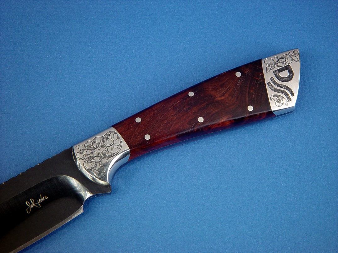 "Rio Grande" in blued O1 high carbon tungsten-vanadium alloy tool steel blade, hand-engraved 304 stainless steel bolsters, Honduras Rosewood Burl hardwood handle, hand-stamped basket weave leather sheath