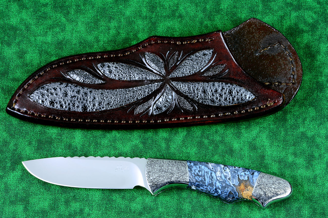 "Thuban" custom knife, obverse side view in CPM154CM powder metal technology, T3 cryogenically treated stainless steel blade, hand-engraved 304 stainless steel bolsters, Moss Agate gemstone handle, hand-carved leather sheath inlaid with frog skin