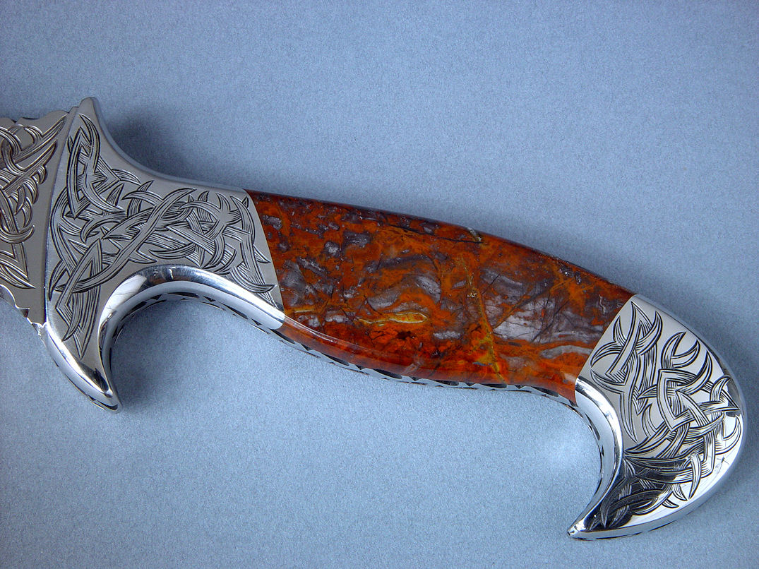 "Tribal" in hand-engraved 440C high chromium stainless steel blade, hand-engraved 304 stainless steel bolsters, Pilbara Picasso Jasper gemstone handle, sheath of hand-carved, hand-dyed leather shoulder, stand of 304 stainless steel, American black walnut, mesquite, lauan hardwoods, engraved black lacquered brass