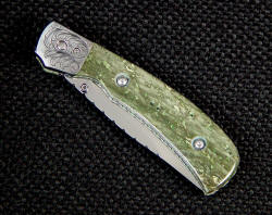 "Gemini" linerlock folding knife closed detail, obverse side. 