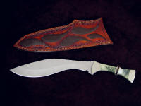 "Maginus-Nasmyth" handmade custom khukri, obverse side view in bead blasted 440C stainless steel blade, nickel silver bolsters, Nephrite Jade gemstone, African Blackwood handle, faux lizard skin inlaid in hand-carved leather sheath